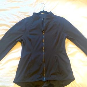 Flattering, stylish black yoga jacket. Never been worn! Size large.